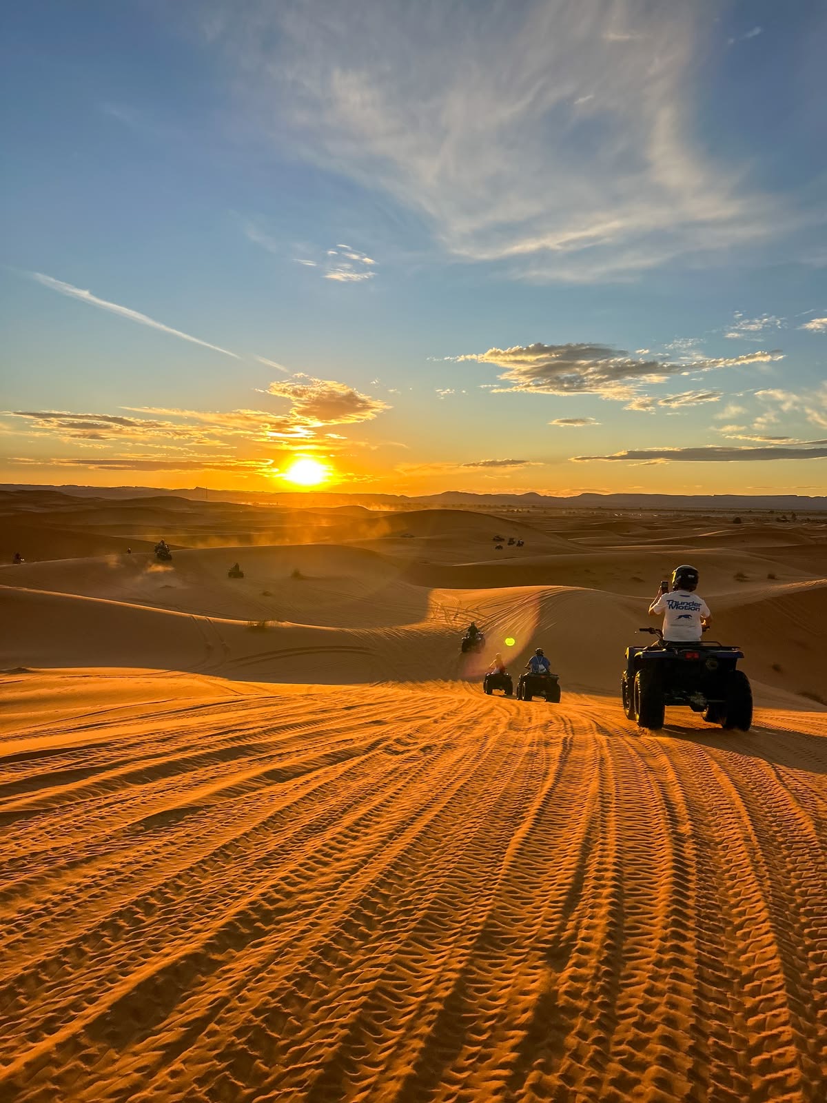 International polo players gathered at a Moroccan stable at sunset